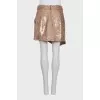 Pleated skirt decorated with sequins