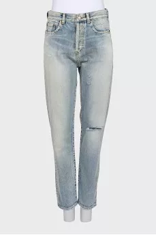 Tapered jeans with distressed buttons