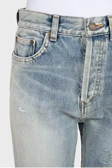 Tapered jeans with distressed buttons