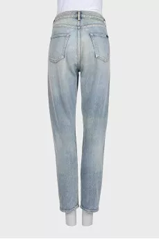 Tapered jeans with distressed buttons