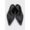 Black leather boots with a shaped heel