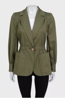 Green fitted jacket with a button