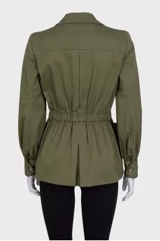 Green fitted jacket with a button