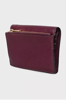 Leather wallet with a button and a brand logo