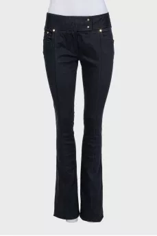 Black flared jeans with gold hardware
