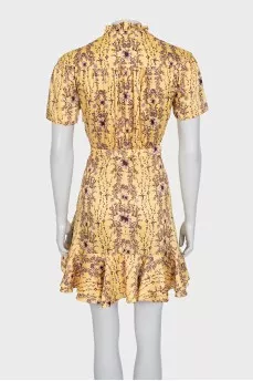 Yellow dress with a floral print belt