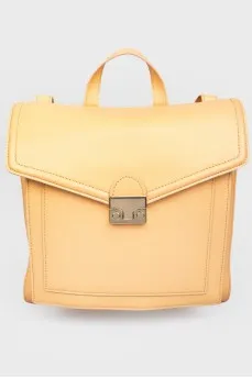 Rectangular leather backpack with tag