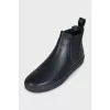 Men's black boots with brand logo