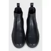 Men's black boots with brand logo