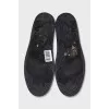 Men's black boots with brand logo