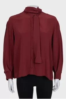 Loose blouse with a high collar