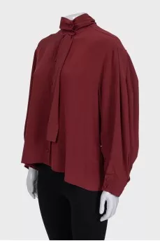 Loose blouse with a high collar