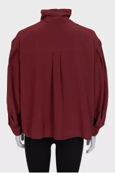 Loose blouse with a high collar