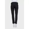 Straight-leg black jeans with fringe