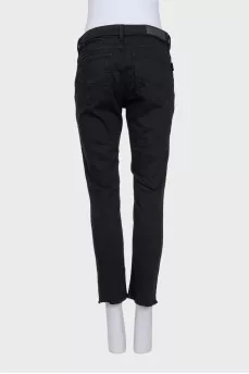 Straight-leg black jeans with fringe