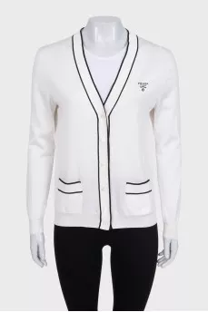White cardigan with embroidered logo and seam accents