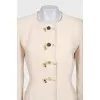Beige coat with button-down logo