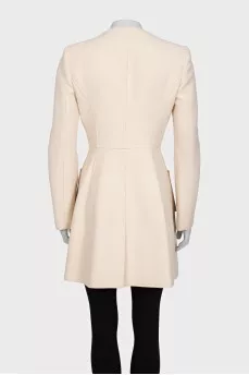 Beige coat with button-down logo