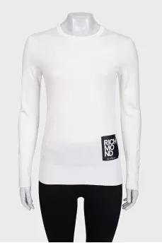 White jumper with gold decor on the sleeves