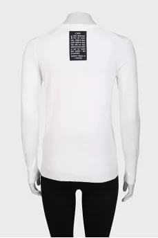 White jumper with gold decor on the sleeves