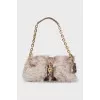 Leather bag decorated with fur