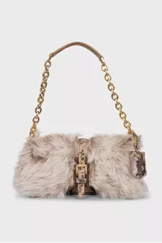 Leather bag decorated with fur
