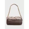 Leather bag decorated with fur