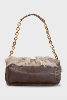 Leather bag decorated with fur