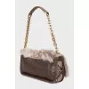 Leather bag decorated with fur