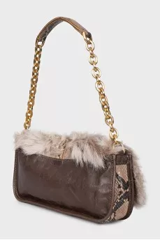 Leather bag decorated with fur