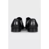 Men's black shoes with a long toe