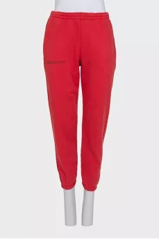 Red sweatshirt and tapered trousers suit
