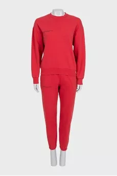 Red sweatshirt and tapered trousers suit