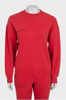 Red sweatshirt and tapered trousers suit