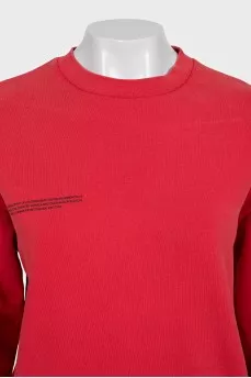 Red sweatshirt and tapered trousers suit