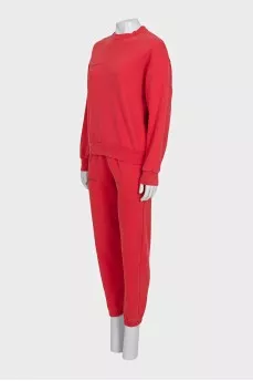 Red sweatshirt and tapered trousers suit