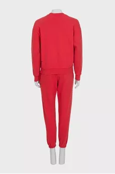 Red sweatshirt and tapered trousers suit