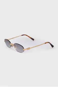 Oval sunglasses with gold hardware