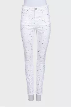White jeans with a small multi-colored print