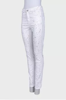 White jeans with a small multi-colored print
