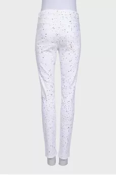 White jeans with a small multi-colored print