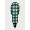 Green coat with a checkered print