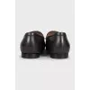 Men's brown leather loafers with embossing