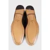 Men's brown leather loafers with embossing