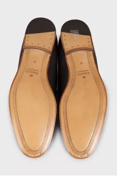 Men's brown leather loafers with embossing