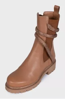 Black leather boots decorated with rhinestones