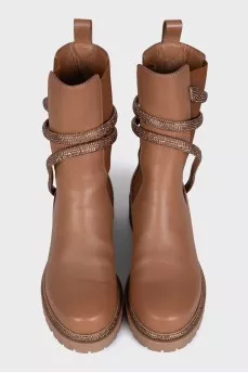 Black leather boots decorated with rhinestones