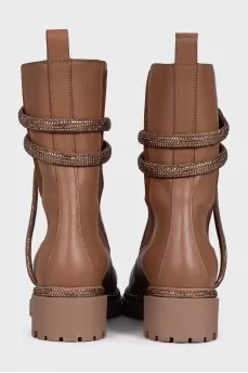 Black leather boots decorated with rhinestones