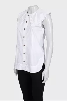White sleeveless blouse with tag