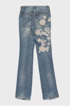 Blue jeans with embroidery and a ripped effect